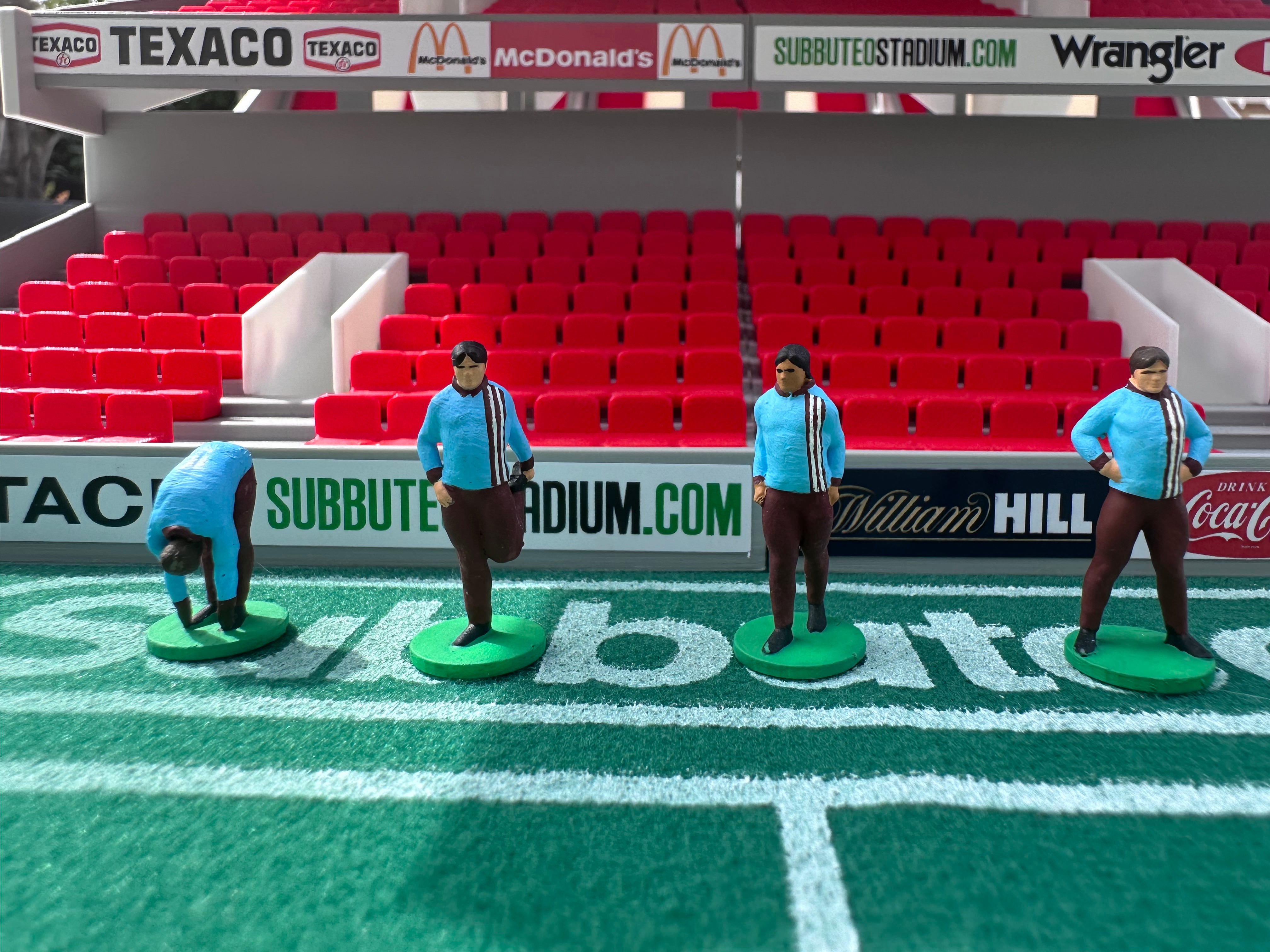 Reserve players warming up – Hand-Painted Subbuteo Accessory (Set of 4)